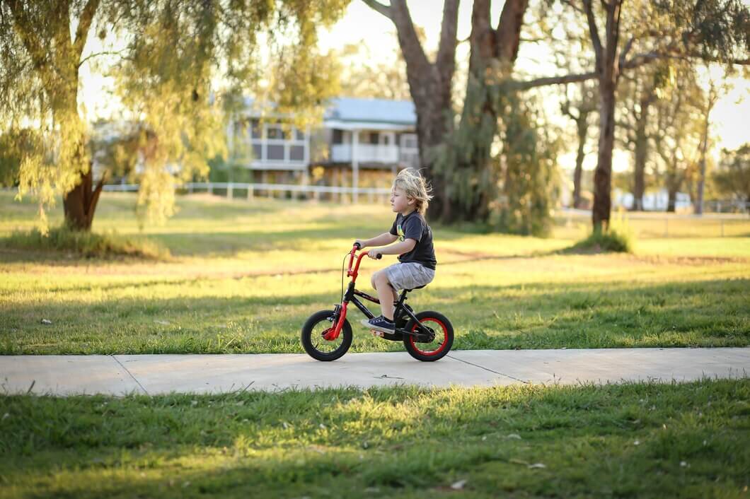 Kid Riding Cycle on the road in the Nature