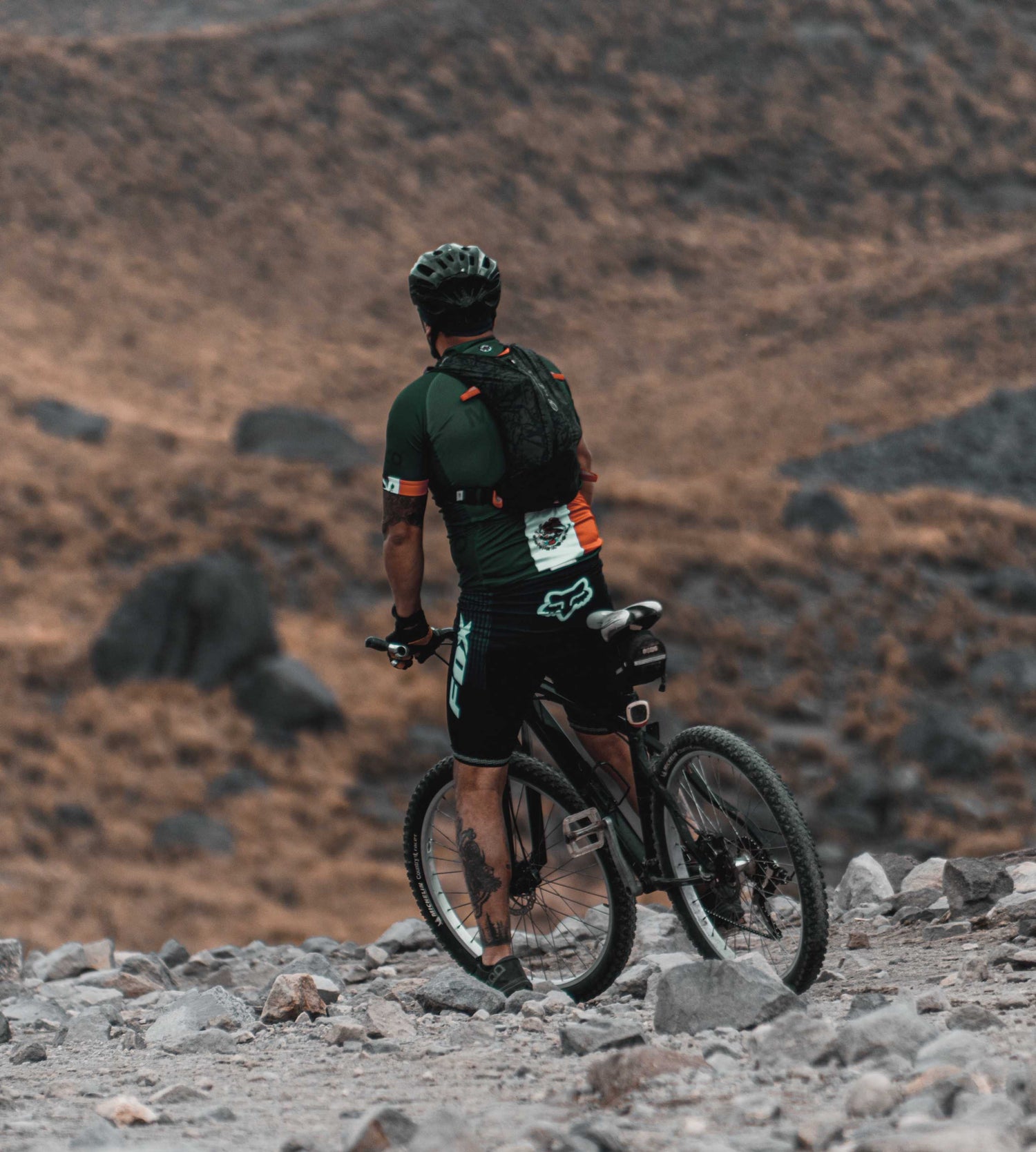 Men with Cycle on Rocks