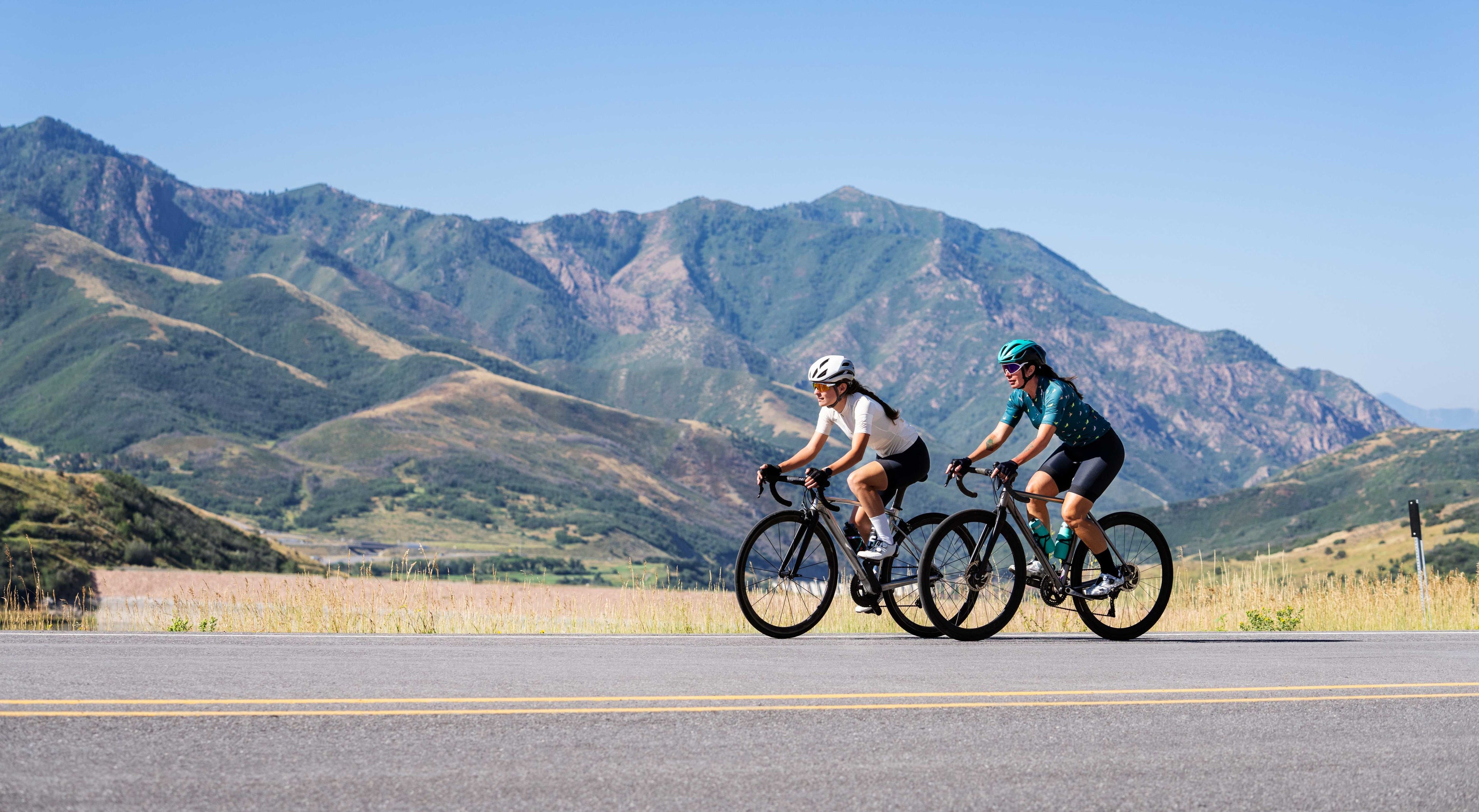 Two female Riding Hybrid Cycle